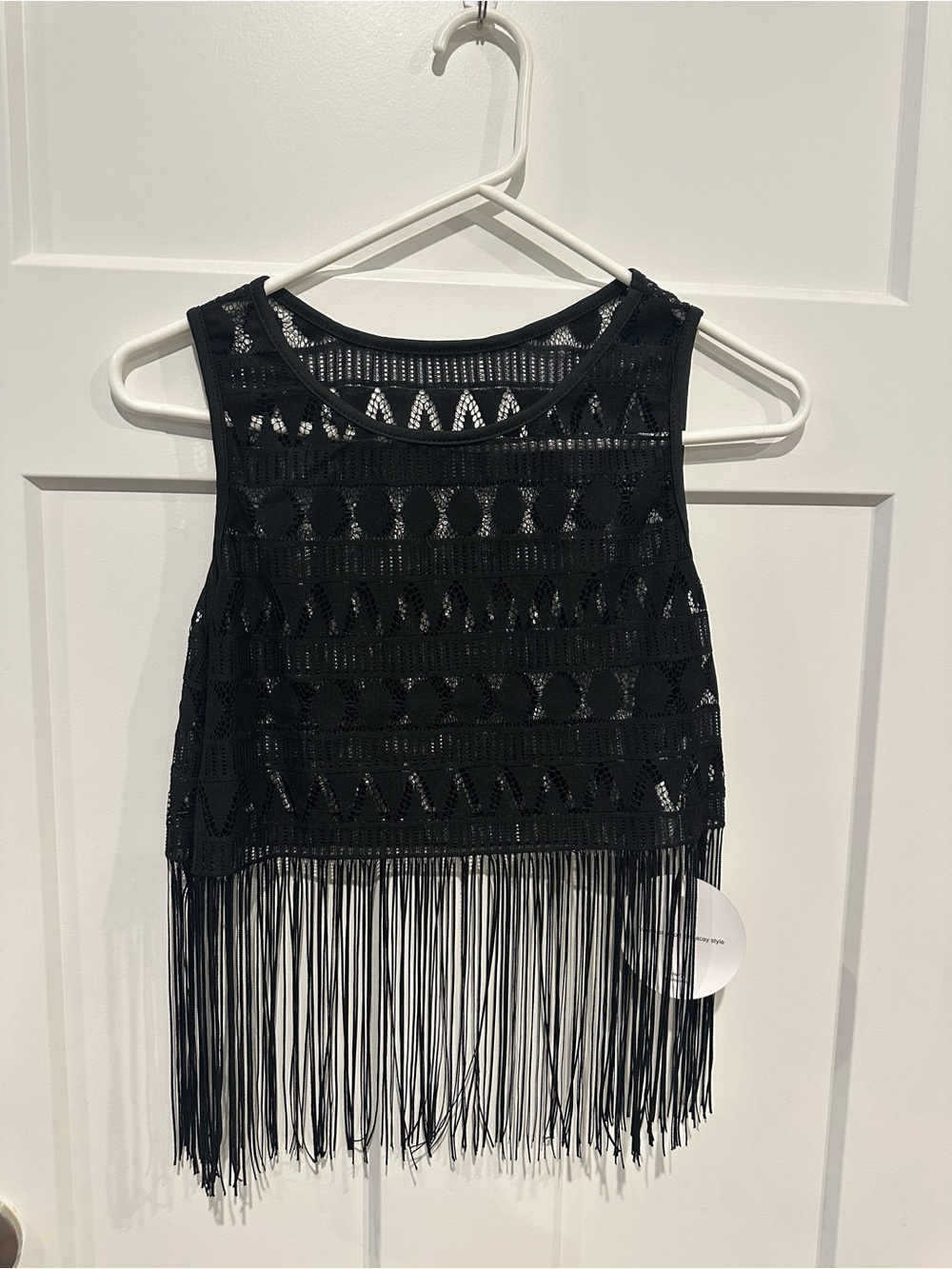 Black crochet crop top with fringe.